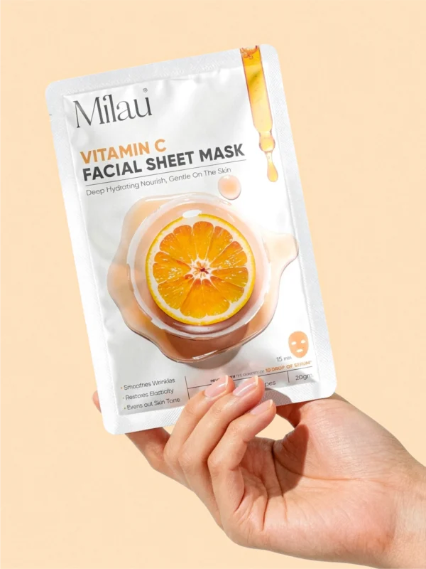 hand holding vitamin c sheet mask brightening glowing skin milau