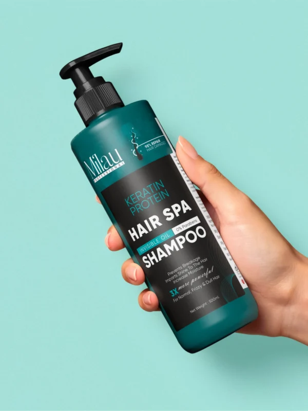 hand holding keratin shampoo bottle with smooth straight hair background