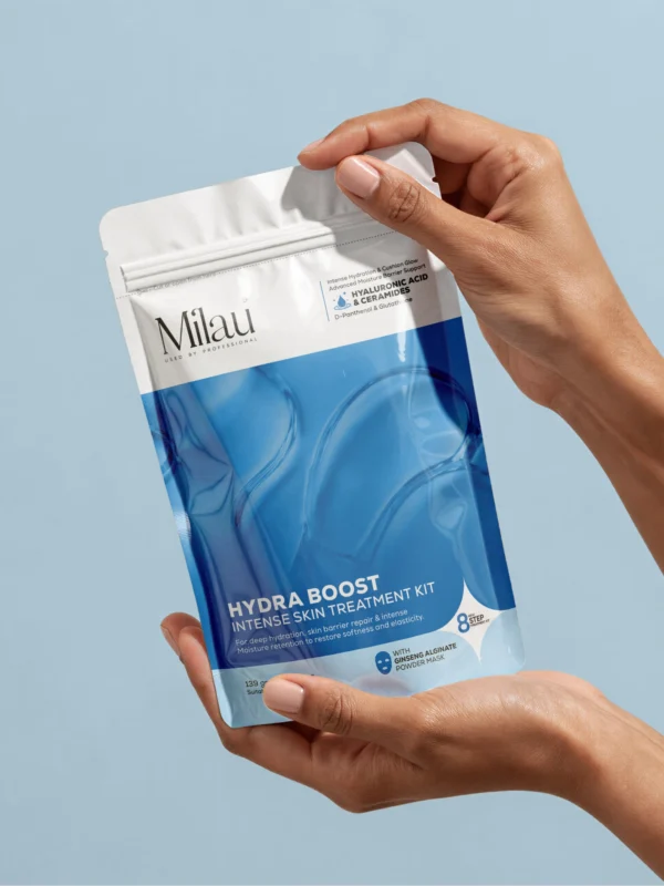 Hand holding hydra boost facial kit pouch for deep hydration and skin barrier repair