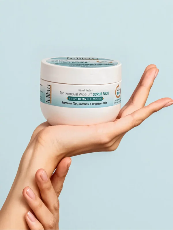 Milau creamy detan pack held in hand instant tan removal brightening skincare product