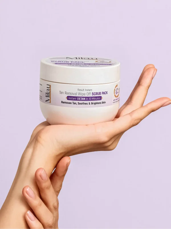Milau detan scrub pack held in hand exfoliating tan removal brightening skincare product